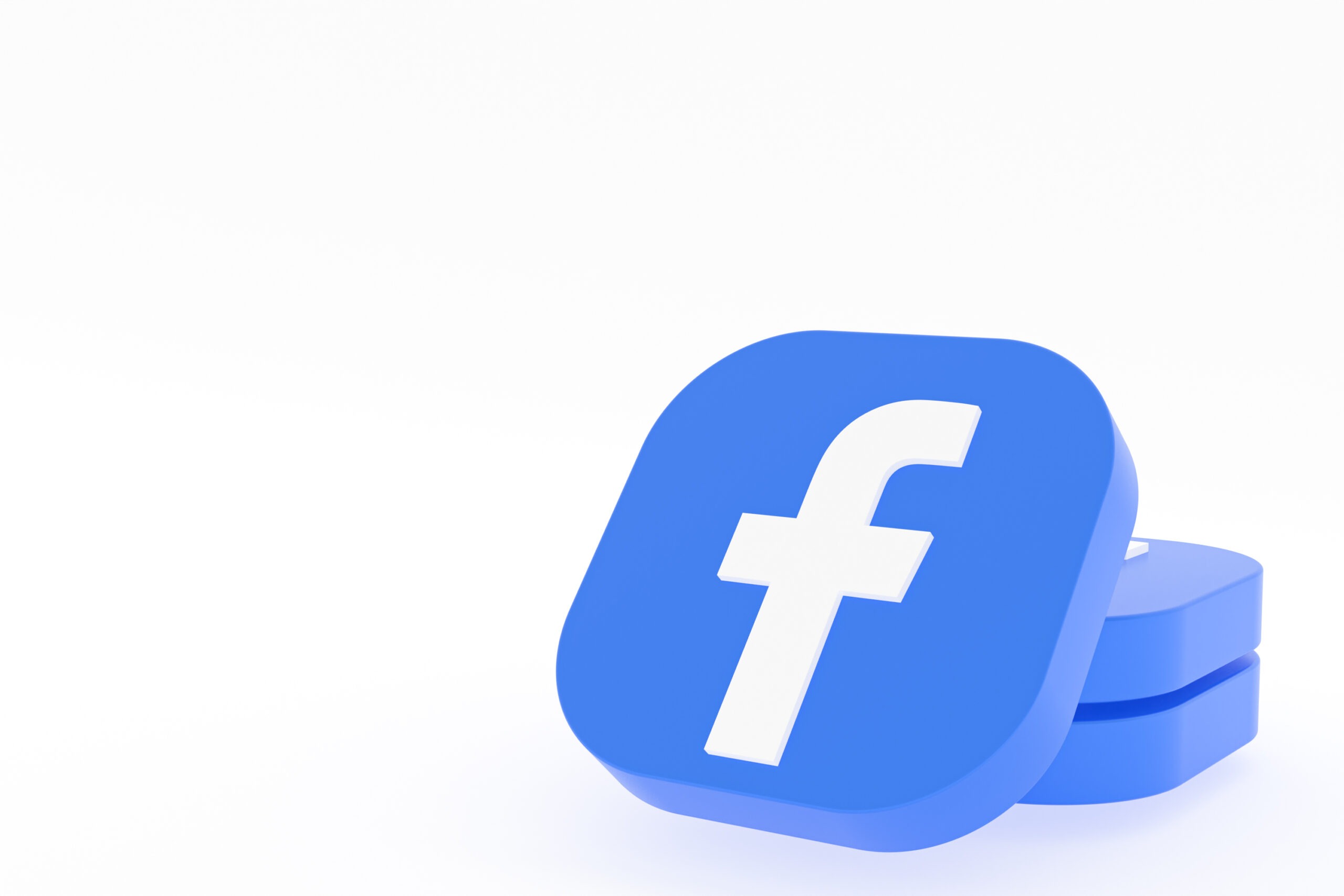 3D rendering of the Facebook icon in a tile format stack on top of a few other blue tiles.