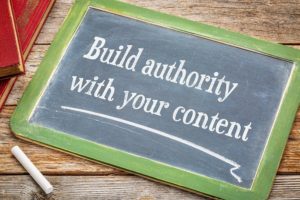A chalkboard describing how important it is to build SEO authority with your content.